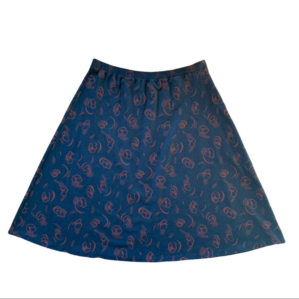 Vintage 90s wool blend Blair skirt in navy with red orange tumbleweed print.